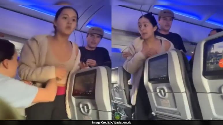 Video: JetBlue Passenger Tries To Open Emergency Exit After Panicking Over 'Barking Dog' Noise Video: JetBlue Passenger Tries To Open Emergency Exit After Panicking Over 'Barking Dog' Noise