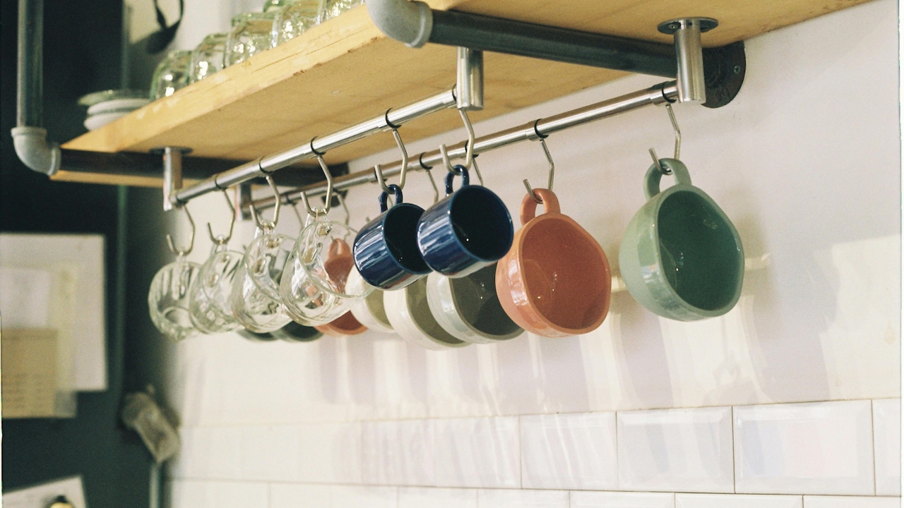 Use hooks to hang pots, pans, and coffee mugs