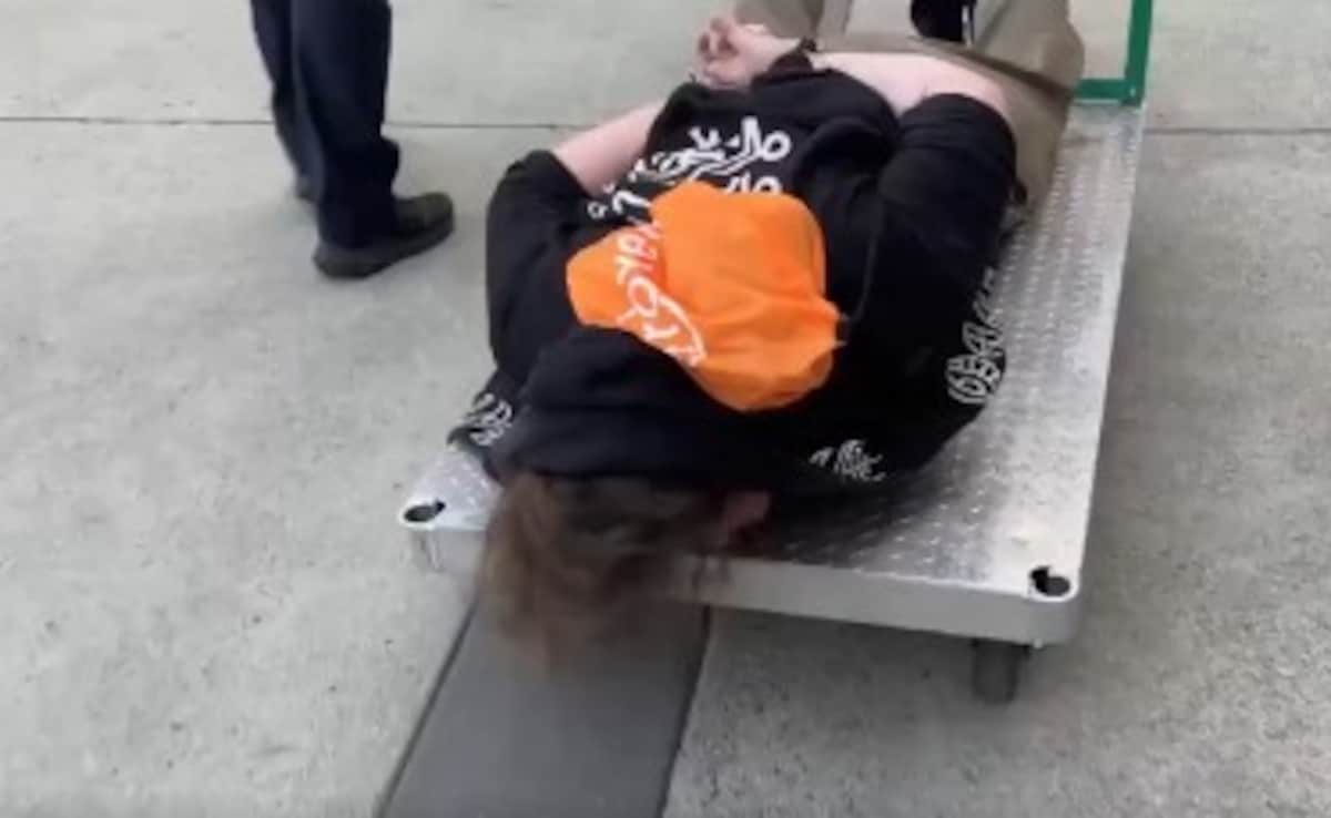 On Camera, Protester Handcuffed, Wheeled Away On Metal Cart By US Officials
