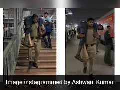 Watch: UP Police Officer Carries Man With Disability On Shoulders At Train Station, Wins Hearts
