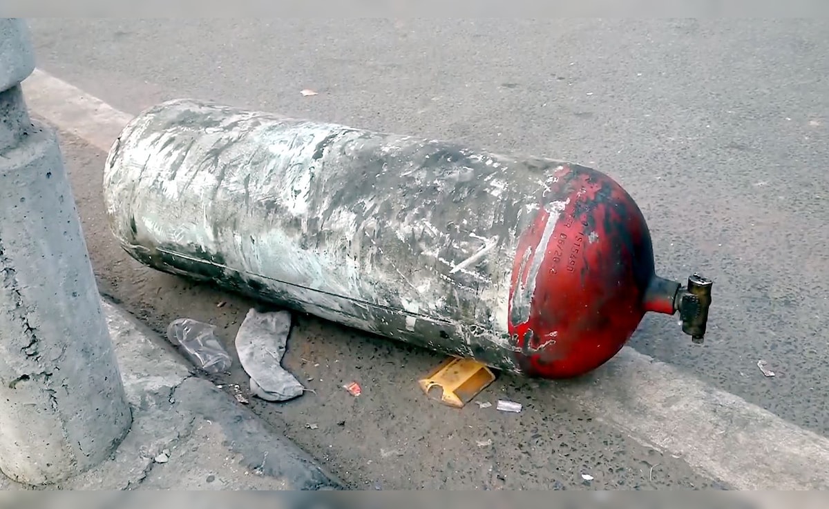 A cylinder lies on the ground following the blast that left 9 people dead on Monday. PTI