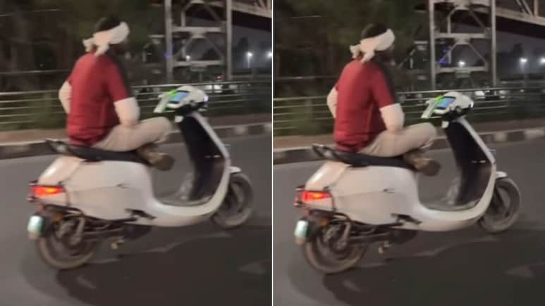 बिना हैंडल पकड़े आलती-पालती मारकर सड़क पर स्कूटी दौड़ा रहा था शख्स, लड़की बोली- गजब ही कैरेक्टर हैं लखनऊ में!