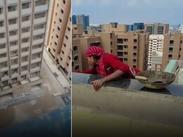 ऊंची इमारत पर लटकी मां, छोटा बच्चे ने व्लॉग में दिखाया, परिवार का पेट पालने के लिए खतरनाक काम करती दिखी महिला