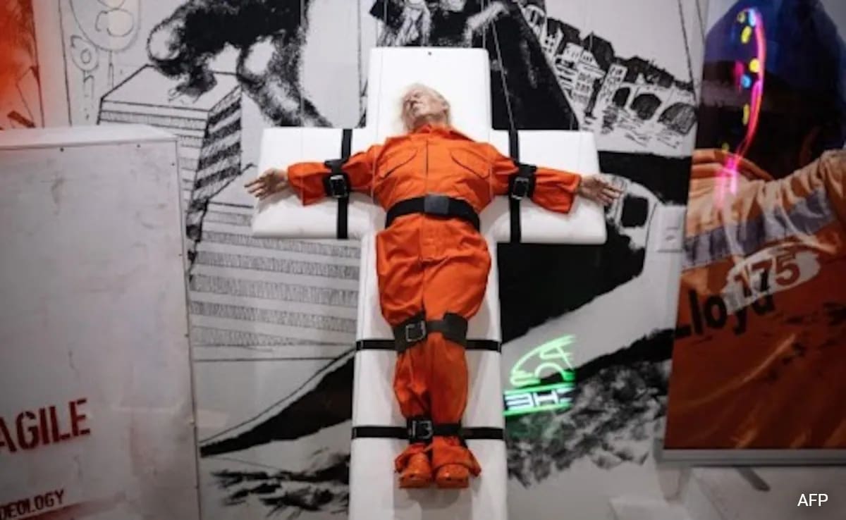 Sculpture Of Trump Strapped To A Cross Displayed In Switzerland