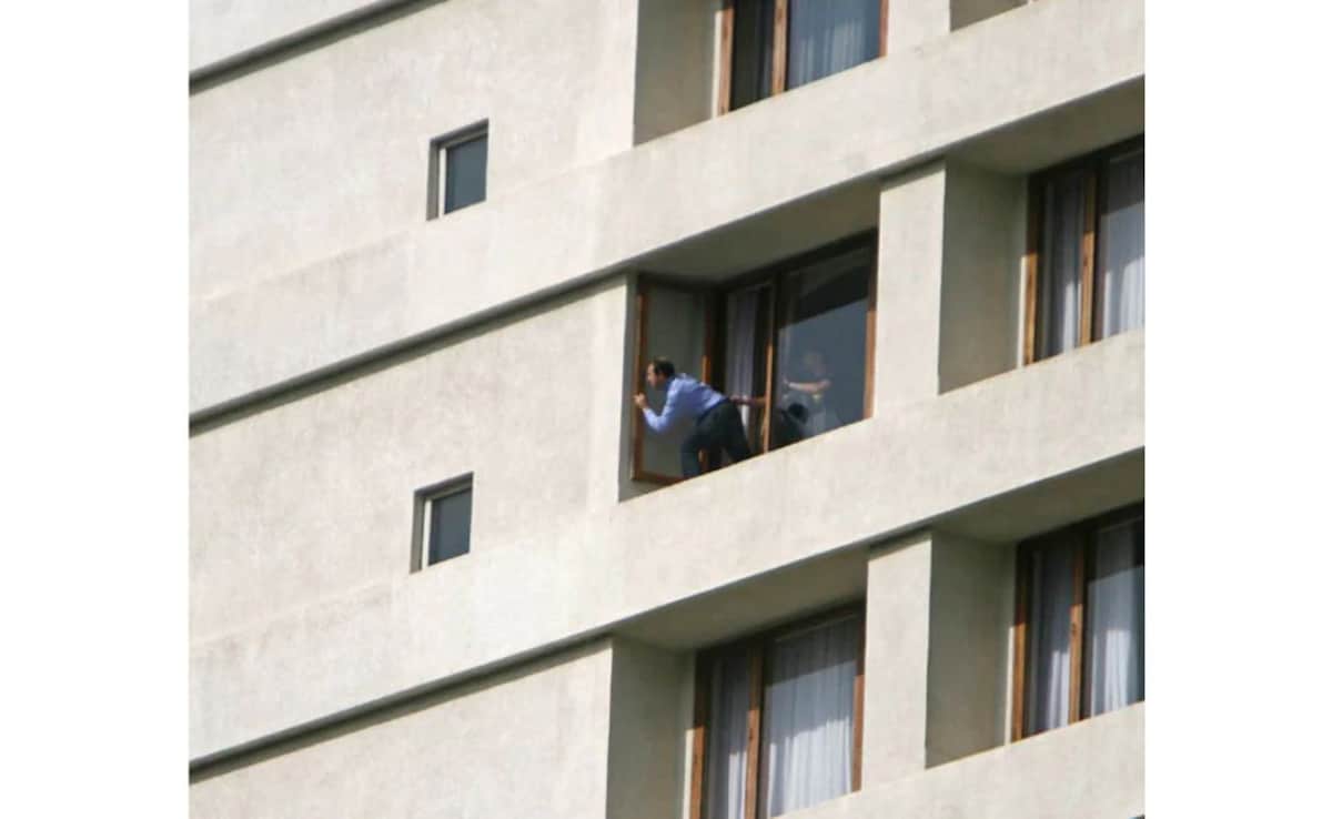 This picture shows a hostage looking out from a window of the hotel.