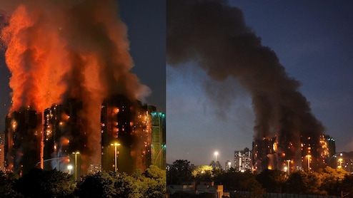 आग की लपटों में भट्ठी बनीं इमारतें, धुएं के गुबार में चीखते-चिल्लाते लोग... तस्वीरें बयां कर रही हांगकांग हादसे का भयावह मंजर