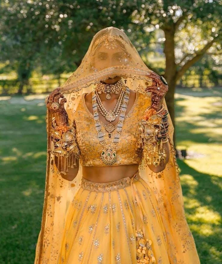 A yellow lehenga glows with happiness and hope. A yellow lehenga glows with happiness and hope.
