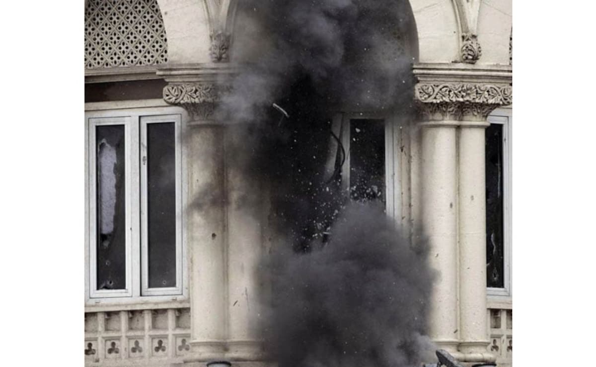 This image shows the windows on the first floor of the Taj Mahal hotel being shattered after the use of a grenade launcher on November 28.