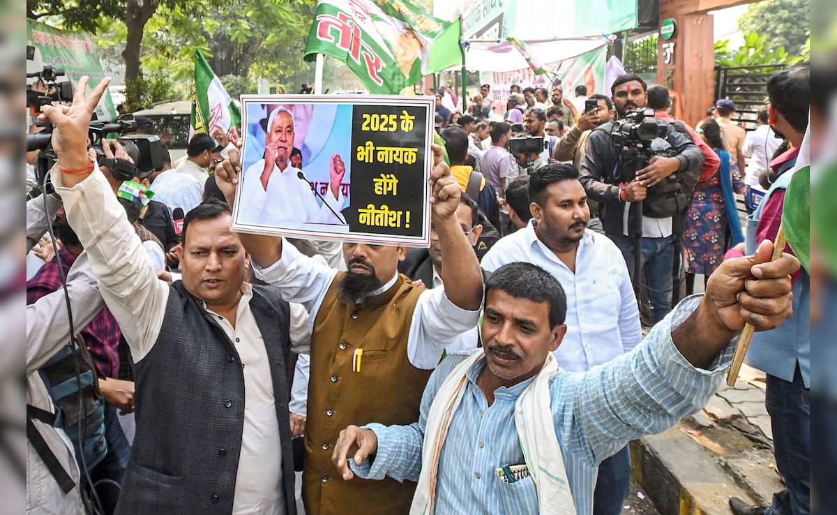JD (U) supporters celebrate as the NDA alliance leads during the counting of votes. PTI