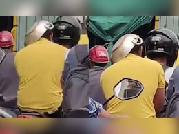 हेलमेट नहीं था इसलिए चालान से बचने के लिए बंदे ने सिर पर रख ली कड़ाही, कैमरे में कैद हुआ झन्नाटेदार Idea