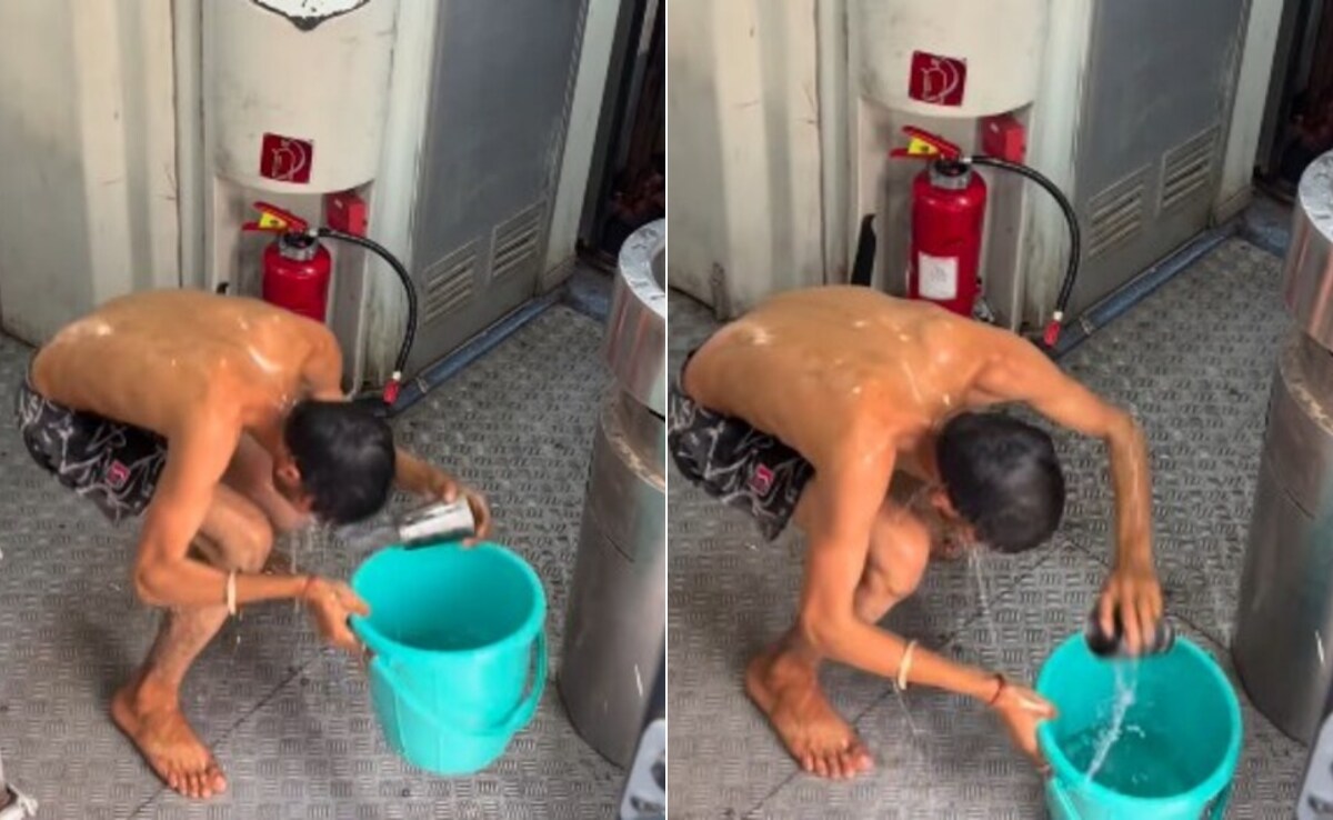 Man Takes Bath in Moving Train for Social Media Fame, Faces Legal Action from Indian Railways