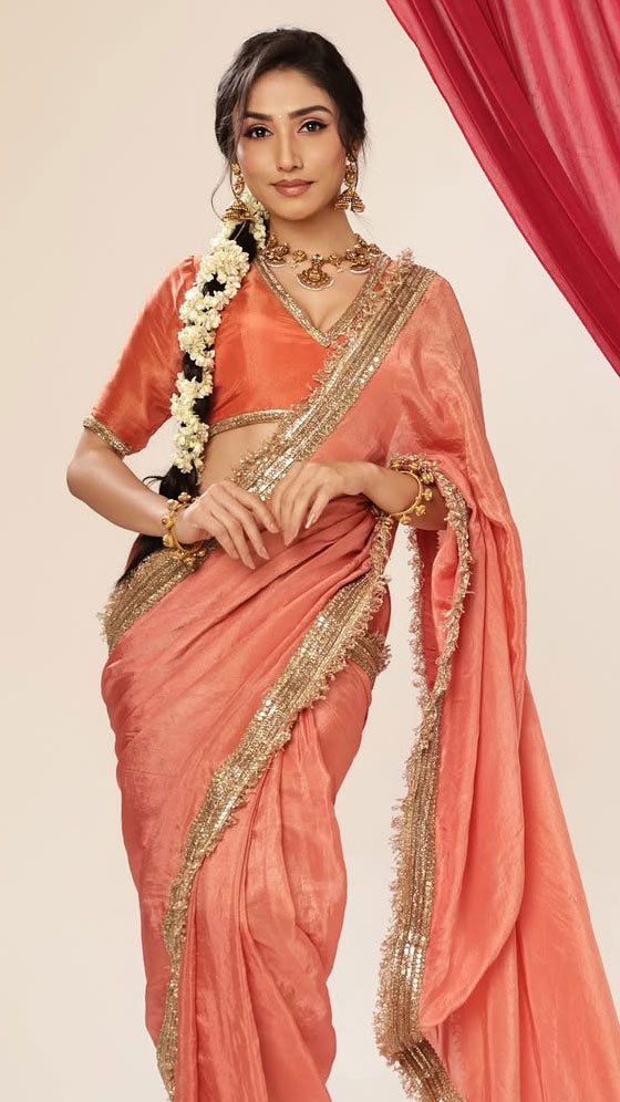 Donal Bist Turns Heads in a Vibrant Peach Saree