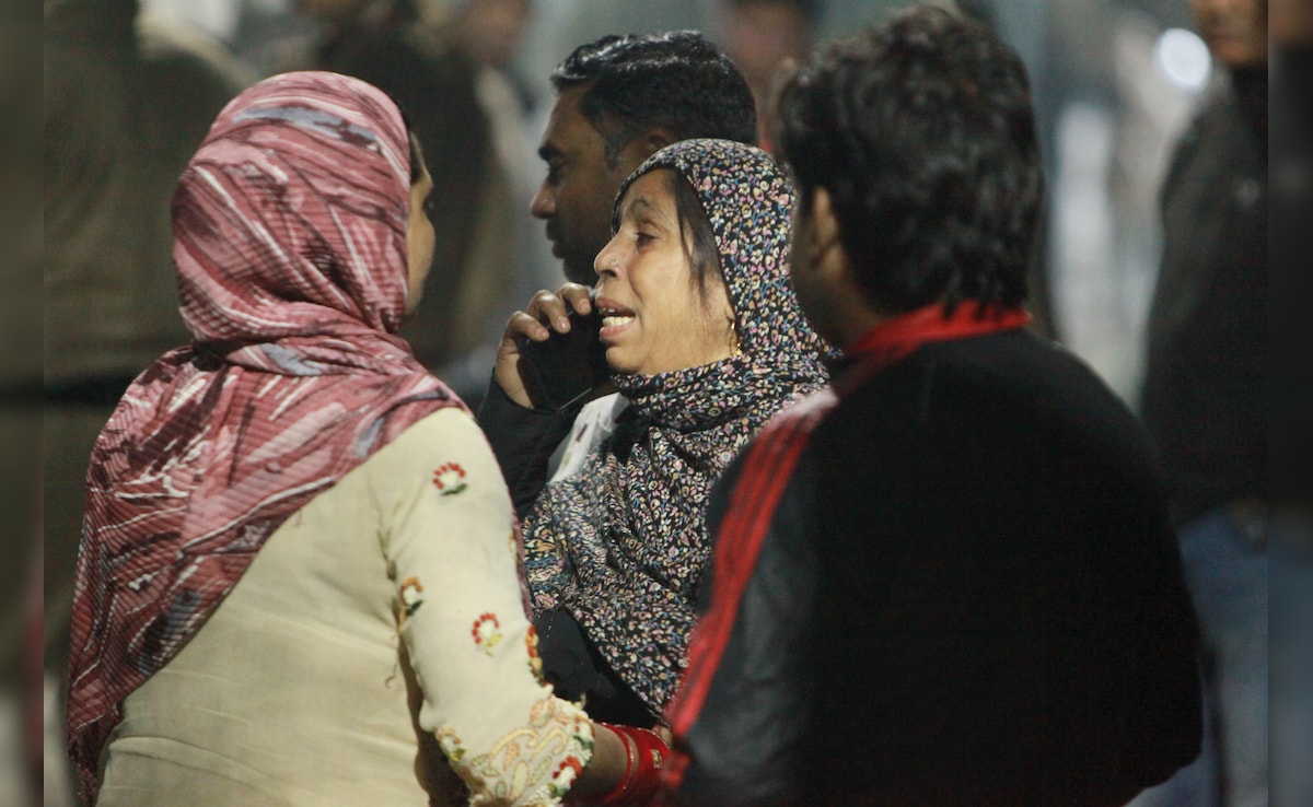 Relatives of victims, who died in the blast near Red Fort metro station, mourn. PTI