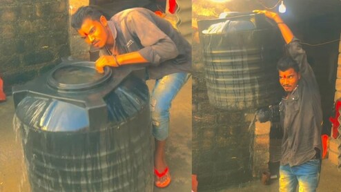 1 हाथ से पानी से भरी टंकी उठाकर ताकत दिखा रहा था बंदा, देख लोग बोले- ये तो 'कलयुगी फर्जी बाहुबली' निकला