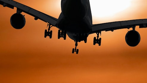 Flying Overnight? 10 Simple Tricks To Beat Jet Lag And Land Looking Alive