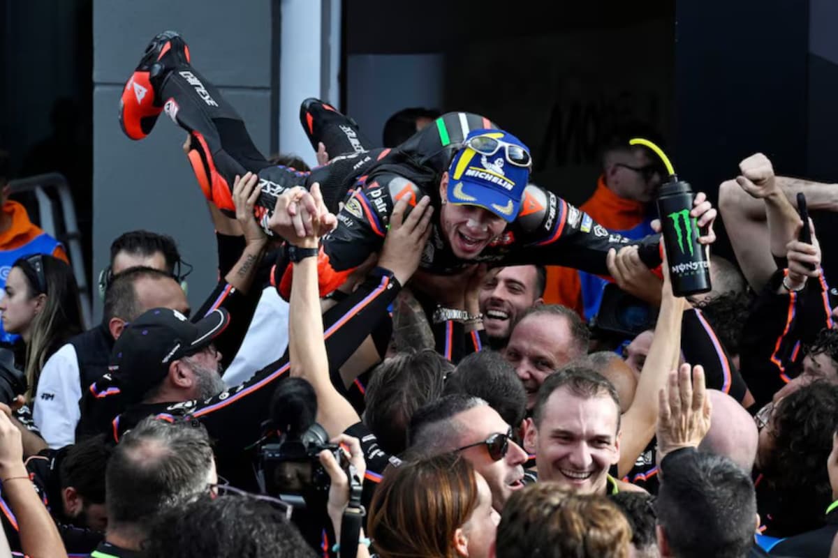 Marco Bezzecchi celebrates his win at Valencia 