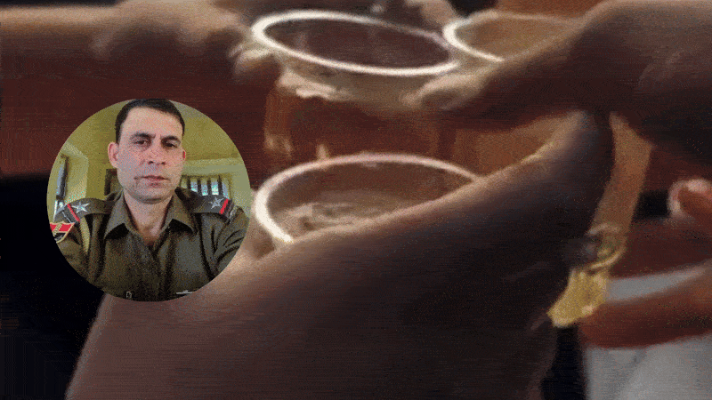 Rajasthan: धौलपुर में गाड़ी चलाते हुए जाम छलका रहे ASI का वीडियो वायरल, SP ने किया निलंबित 