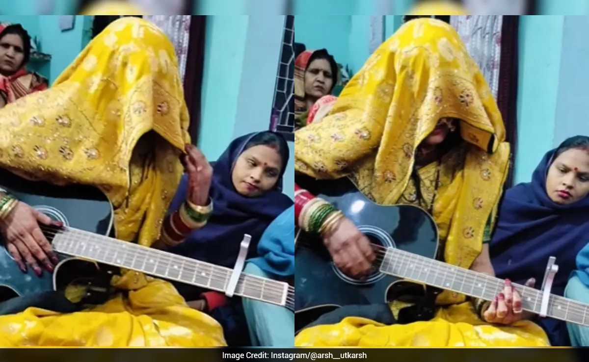 Indian Bride's Guitar Performance in Veil Sparks Debate