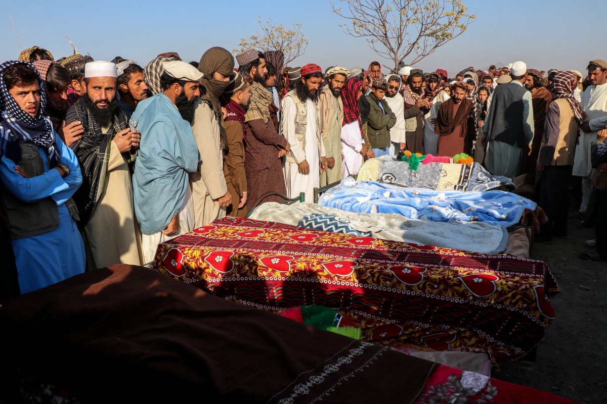 Afghan mourners and relatives of victims gather during a mass burial ceremony for nine children and one woman who were killed by a Pakistan air strike Afghan mourners and relatives of victims gather during a mass burial ceremony for nine children and one woman who were killed by a Pakistan air strike