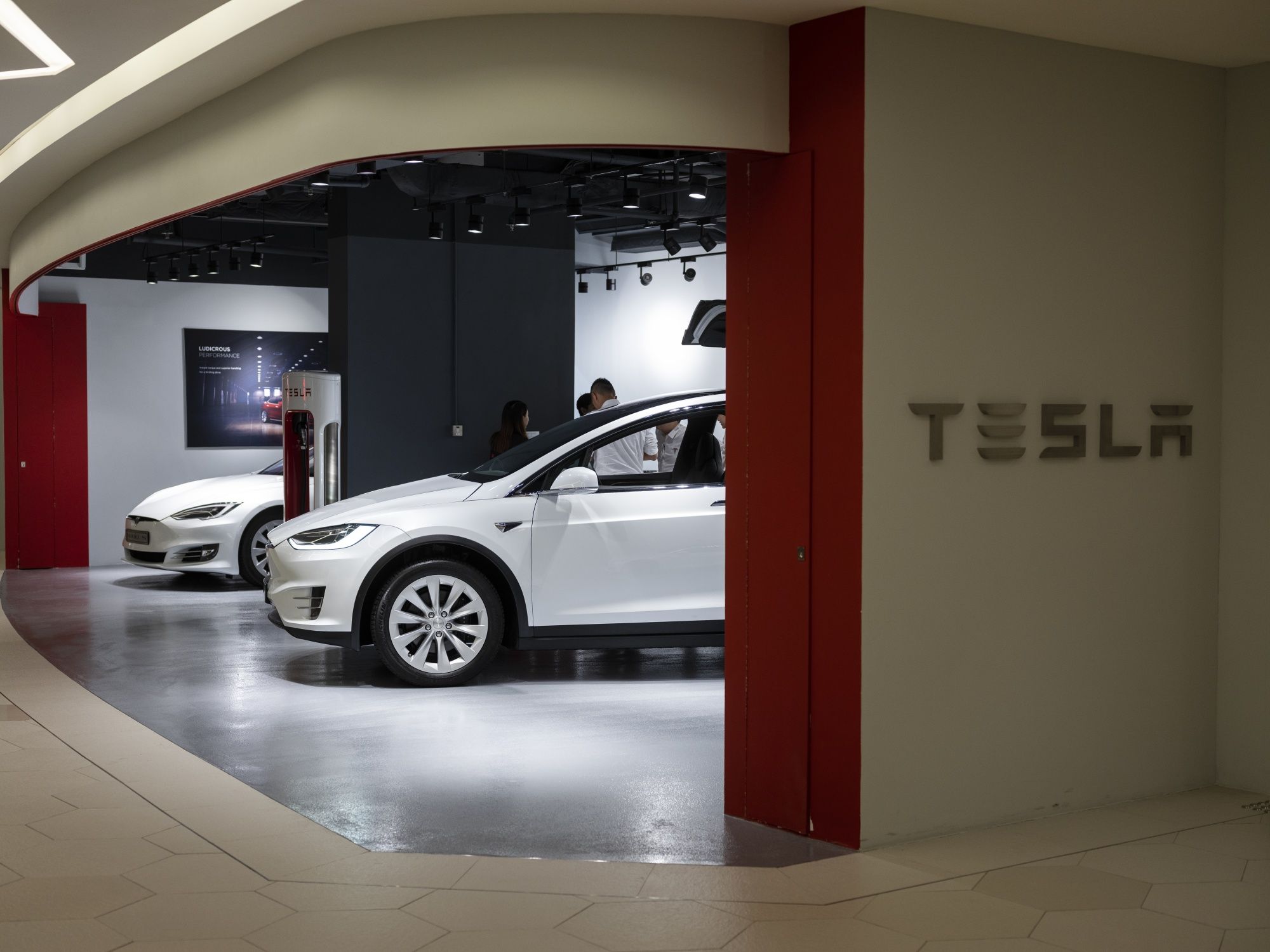 Tesla Sinks 50% From November Record High As Troubles Pile Up