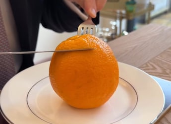 Etiquette Coach Teaches How To Formally Eat An Orange, Internet Reacts