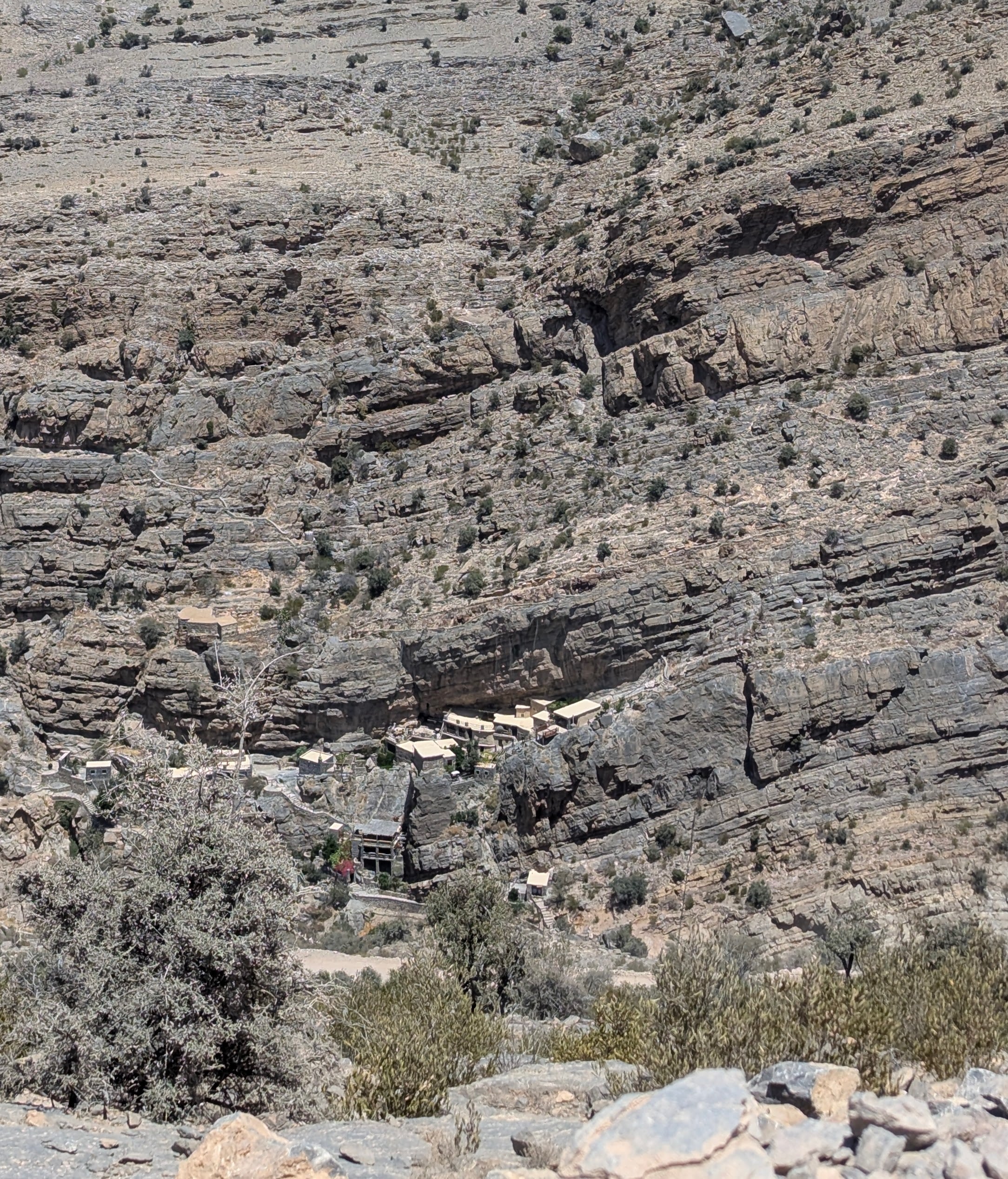 Homes carved into the Al Hajar mountains in Jabal Akhdar. Photo: Author Homes carved into the Al Hajar mountains in Jabal Akhdar. Photo: Author