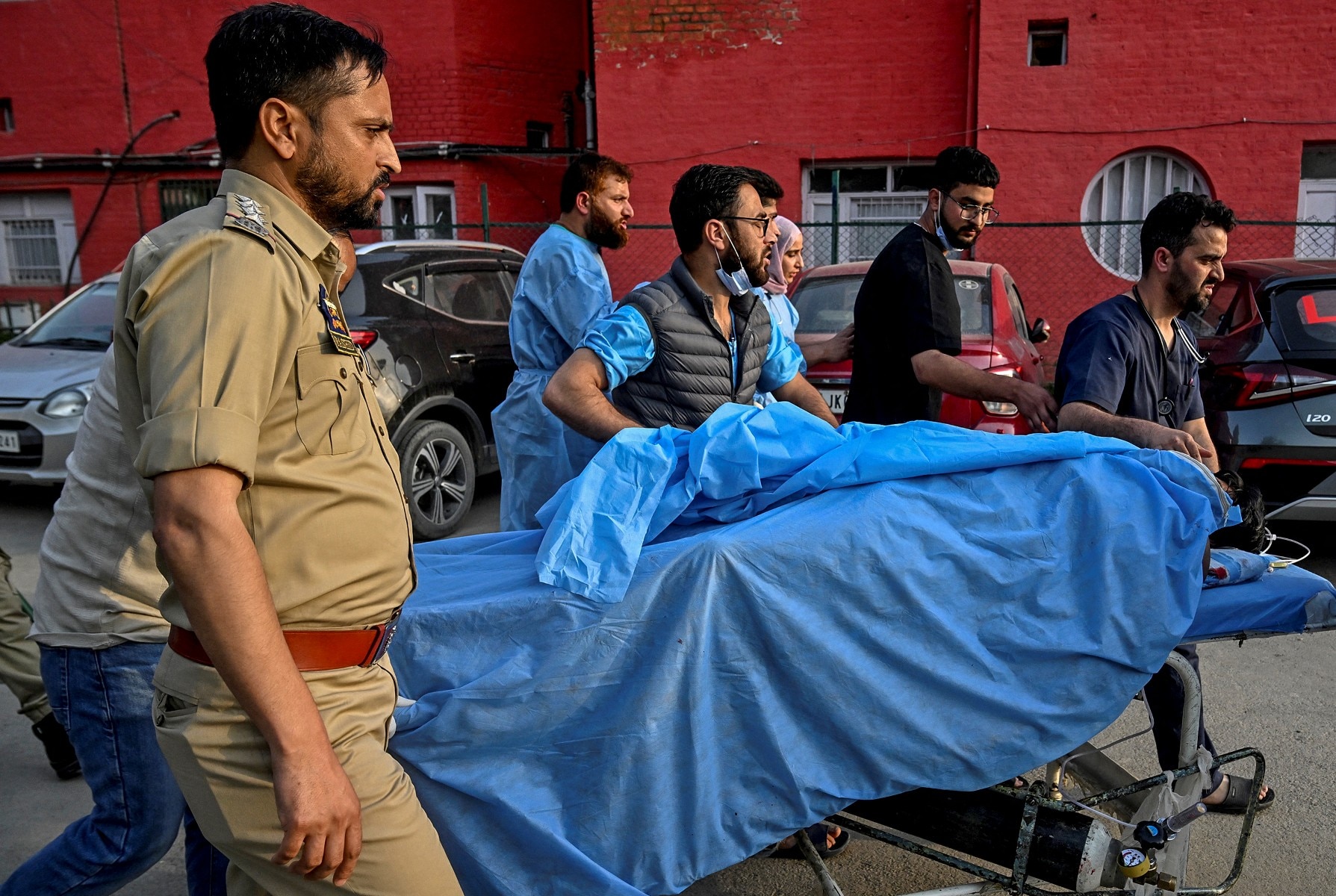Paramedics and police personnel carry an injured tourist at a hospital in Anantnag after Pahalgam attack Paramedics and police personnel carry an injured tourist at a hospital in Anantnag after Pahalgam attack