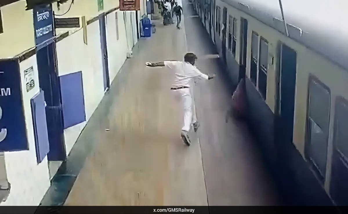Railway Staff Saves Woman from Falling Under Train