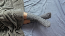 Should You Sleep With Your Socks On In Winters? Health Pros And Cons Explained