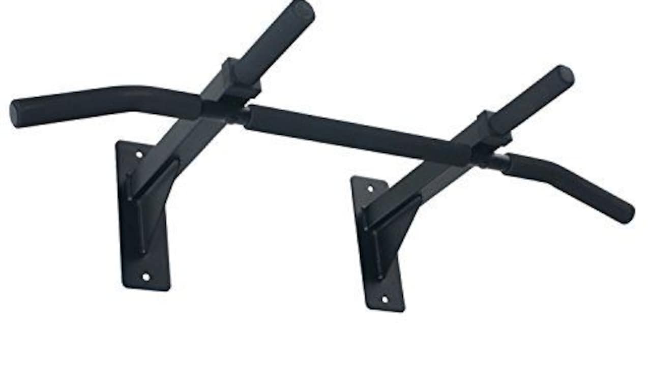 A sturdy pull-up bar fitted in a home gym space for upper-body strength training.