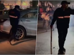 मर्सिडीज ड्राइवर ने गार्ड से की मारपीट, गुस्से में गार्ड ने कार पर बरसाए लाठी-डंडे