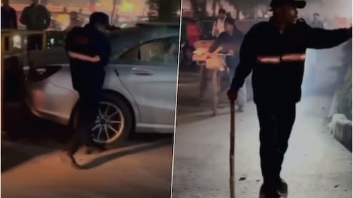 मर्सिडीज ड्राइवर ने गार्ड से की मारपीट, गुस्से में गार्ड ने कार पर बरसाए लाठी-डंडे