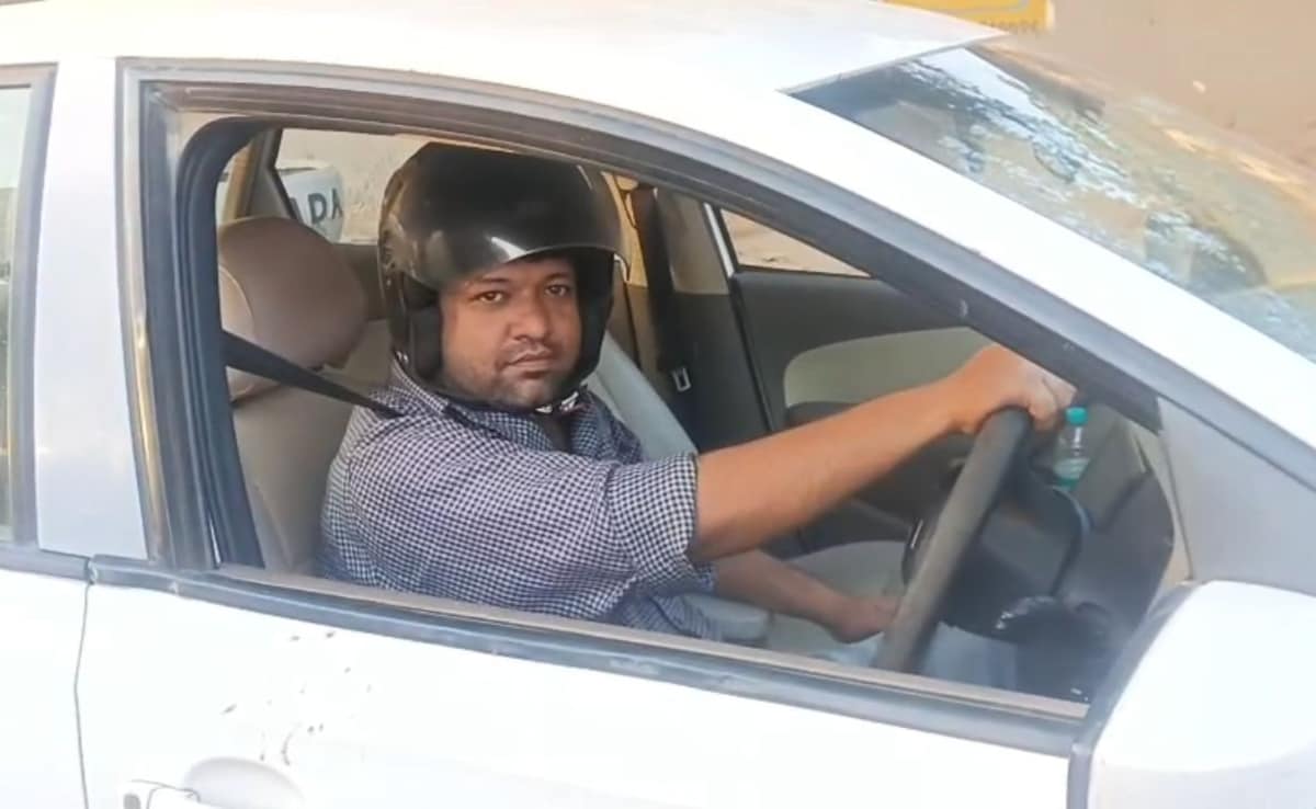 UP Man Drives Car Wearing Helmet After Being Fined For Not Wearing One