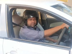 UP Man Drives Car Wearing Helmet After Being Fined For Not Wearing One