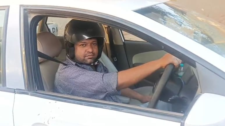 UP Man Drives Car Wearing Helmet After Being Fined For Not Wearing One