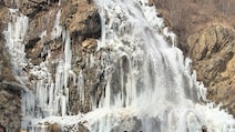 Pics: Frozen Waterfall Draws Tourists In Gulmarg, Cold Wave Persists In J&K