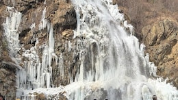 Pics: Frozen Waterfall Draws Tourists In Gulmarg, Cold Wave Persists In J&K