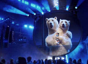 Viral: New Pepsi Ad Has Coca-Cola Bear 'Cheating' In Coldplay Kiss Cam Twist