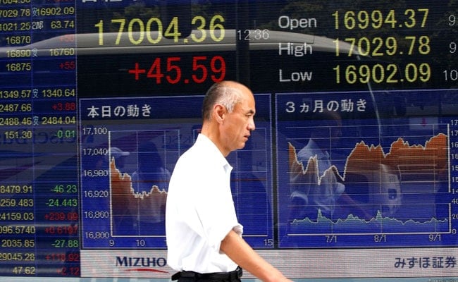 Asian Shares Mixed, Yen Holds Gains After Germany, Turkey Incidents