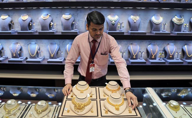 Gold Prices Hit Record High On Safe-Haven Rush, Weak Rupee