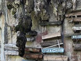 Why This Tribe In The Philippines Hangs Coffins From Cliffs