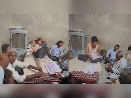 रजवाडे़ की तरह खाट पर लेटा पटवारी, लोगों को जमीन पर बैठाया; पैसा लेने का वीड&zwj;ियो वायरल