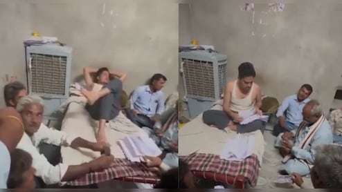 रजवाडे़ की तरह खाट पर लेटा पटवारी, लोगों को जमीन पर बैठाया; पैसा लेने का वीड&zwj;ियो वायरल