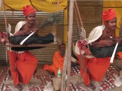 <i>Sadhu</i> Claiming To Be Standing For 7 Years Draws Attention At Magh Mela