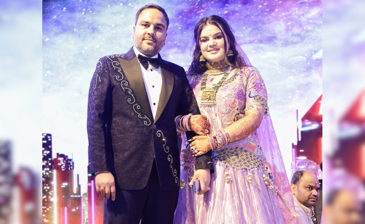 Shiv Johri with his daughter Shruti Johri for whom he created a wedding invite.