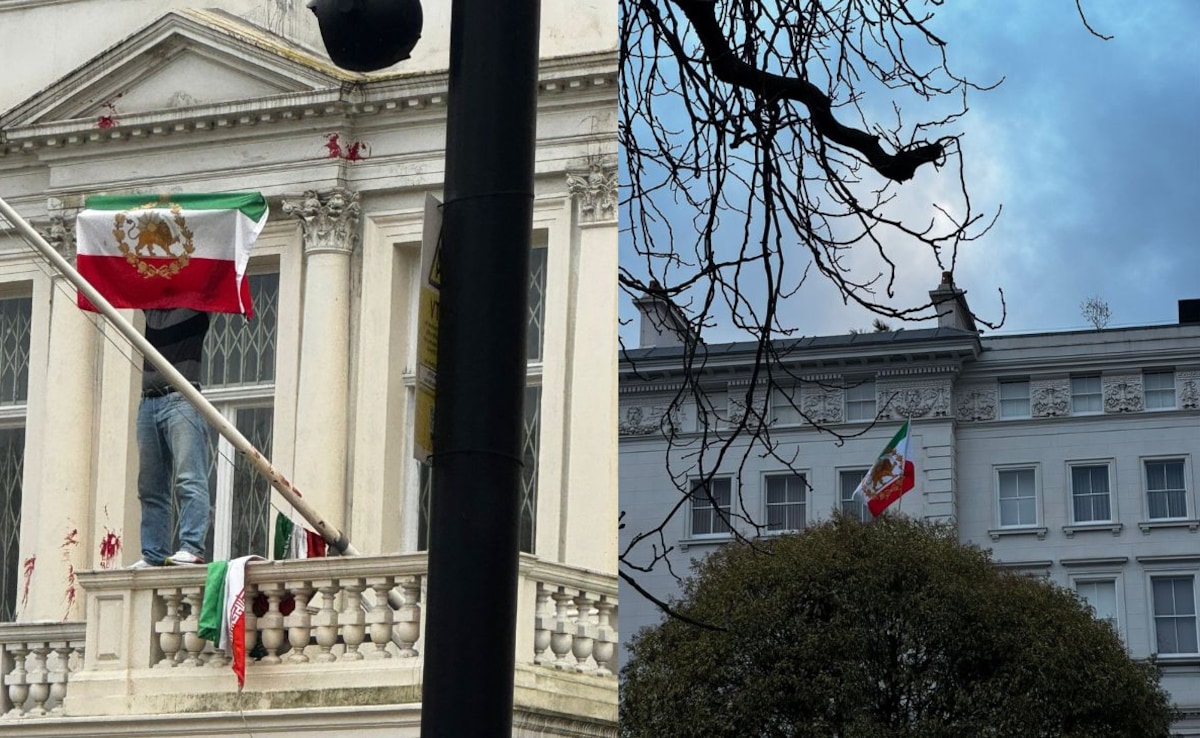 Demonstranten zetten de Iraanse vlag van vóór de islamitische revolutie op de ambassade van Londen
