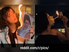 Why Images Of Iranian Women Lighting Cigarettes With Khamenei's Photo Are Going Viral