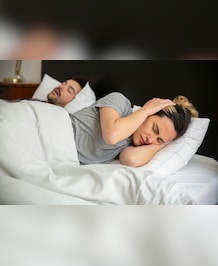 7 Tips For Sleeping With Someone Who Snores