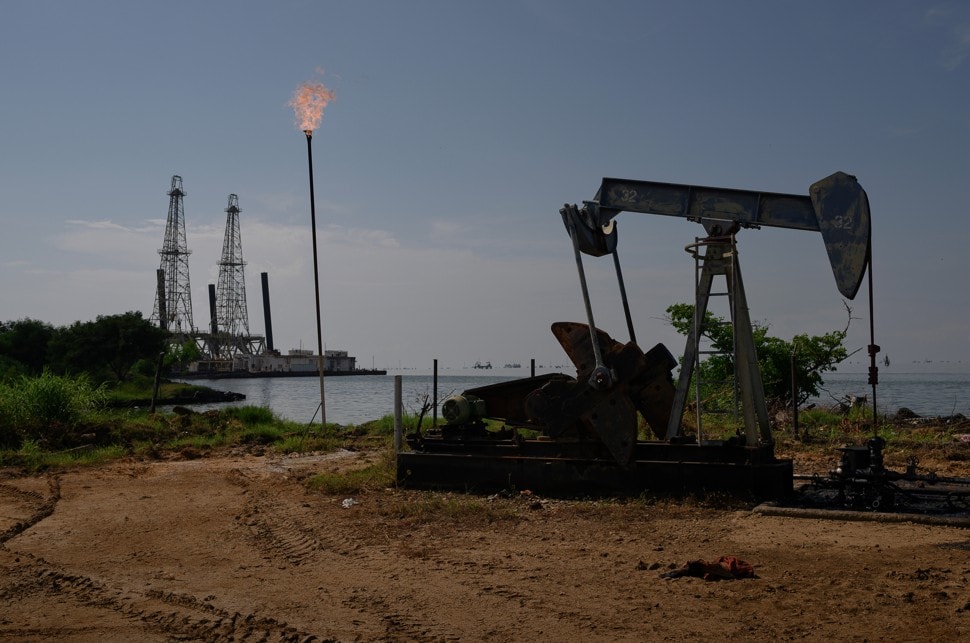 A Petroleos de Venezuela SA oil pumpjack on Lake Maracaibo in Cabimas, Zulia state, Venezuela. Photographer: Bloomberg