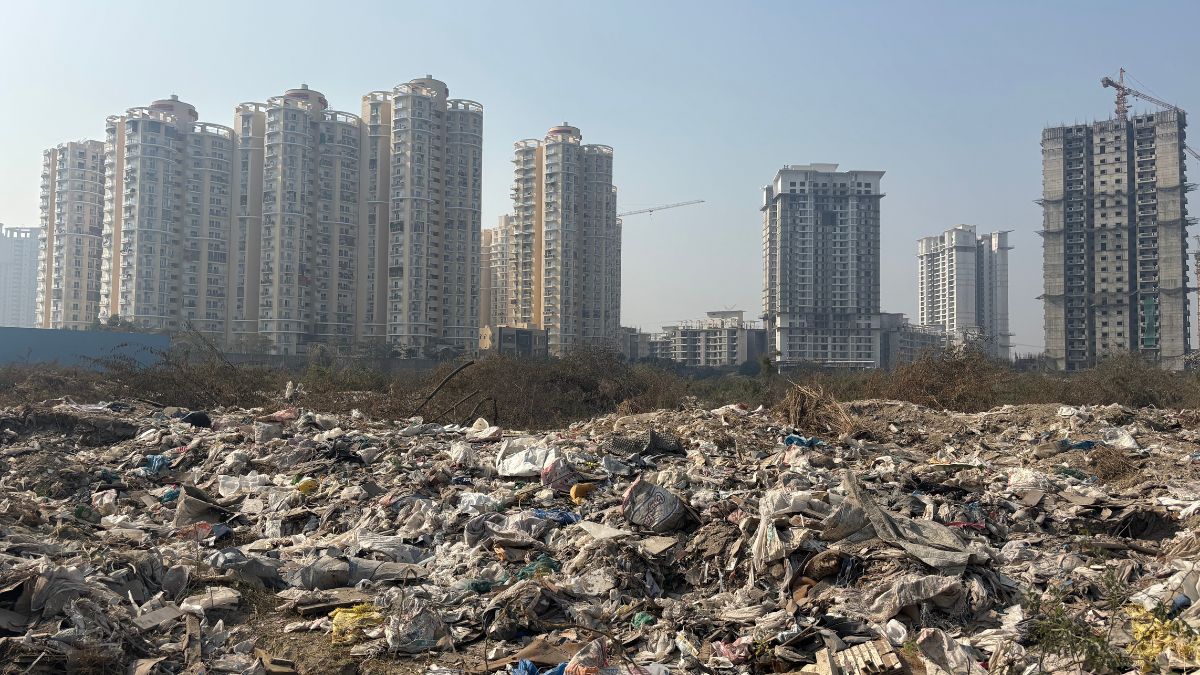 Garbage dumpyard in an open plot in Noida.